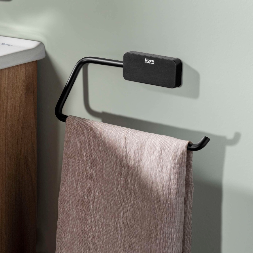 Lifestyle image of the Roca Sonata Matt Black Towel Ring hanging a towel